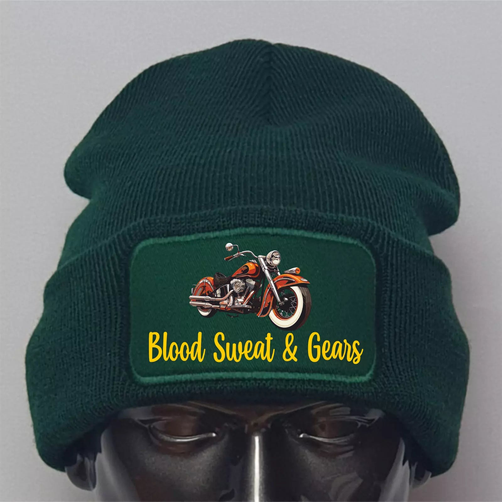 Green beanie with a motorcycle graphic and 'Blood Sweat & Gears' text on a gray background