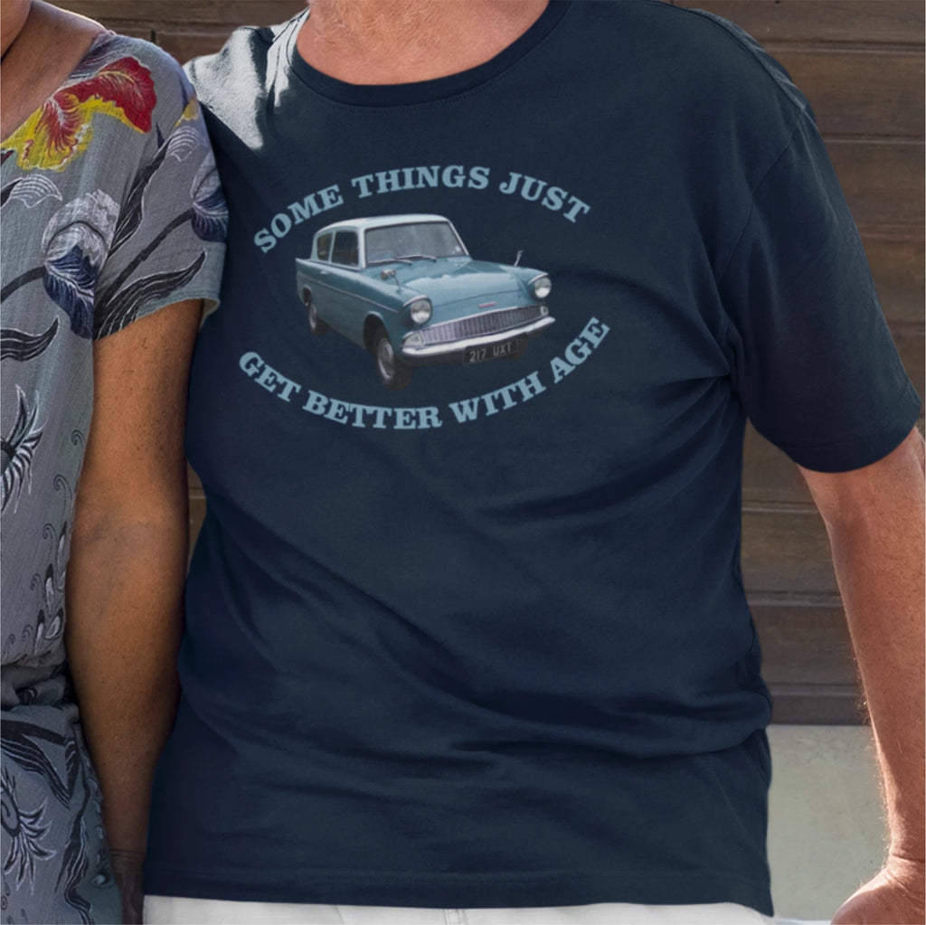Navy blue t-shirt with vintage car graphic and text worn by a person.