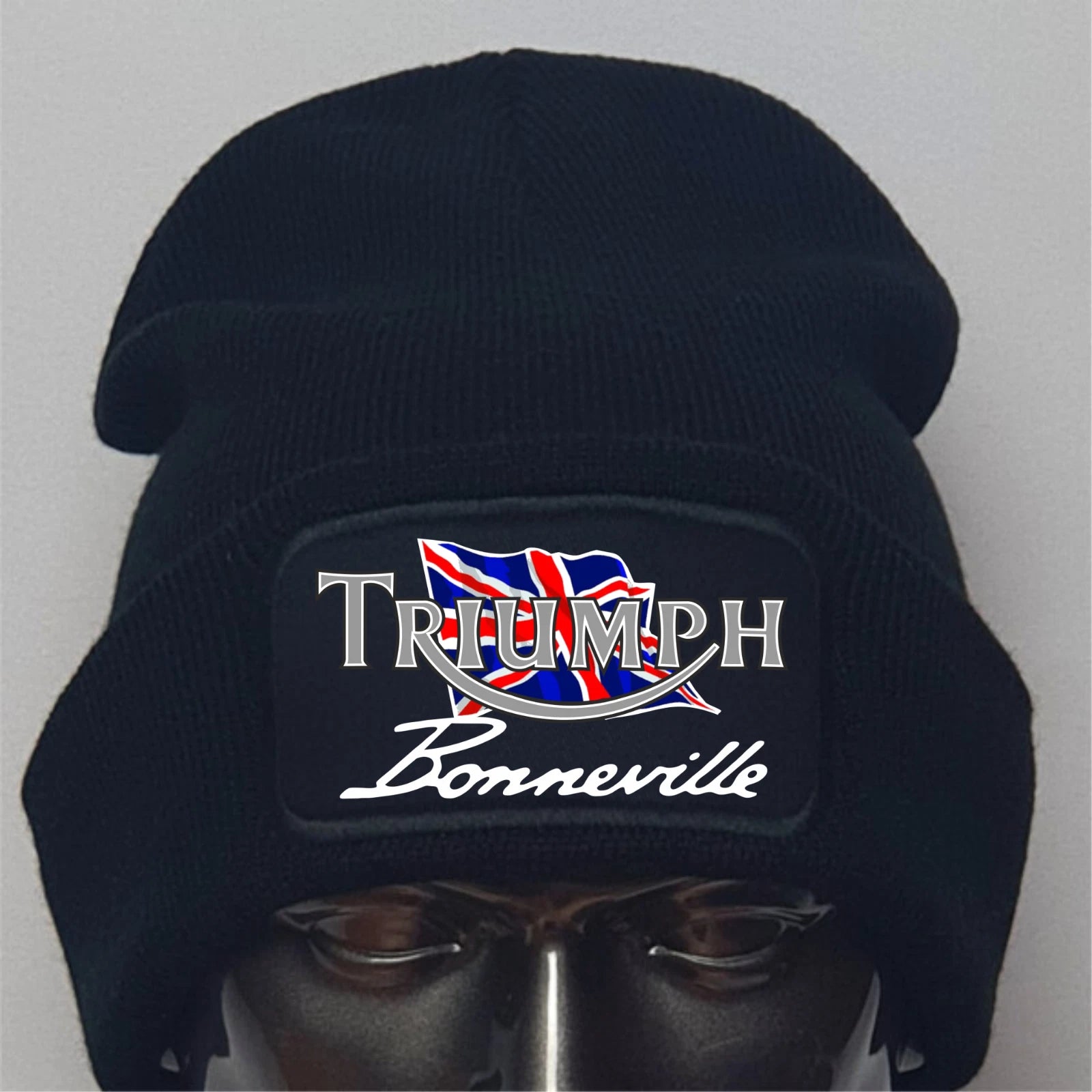 Black beanie with Triumph Bonneville logo on a gray background