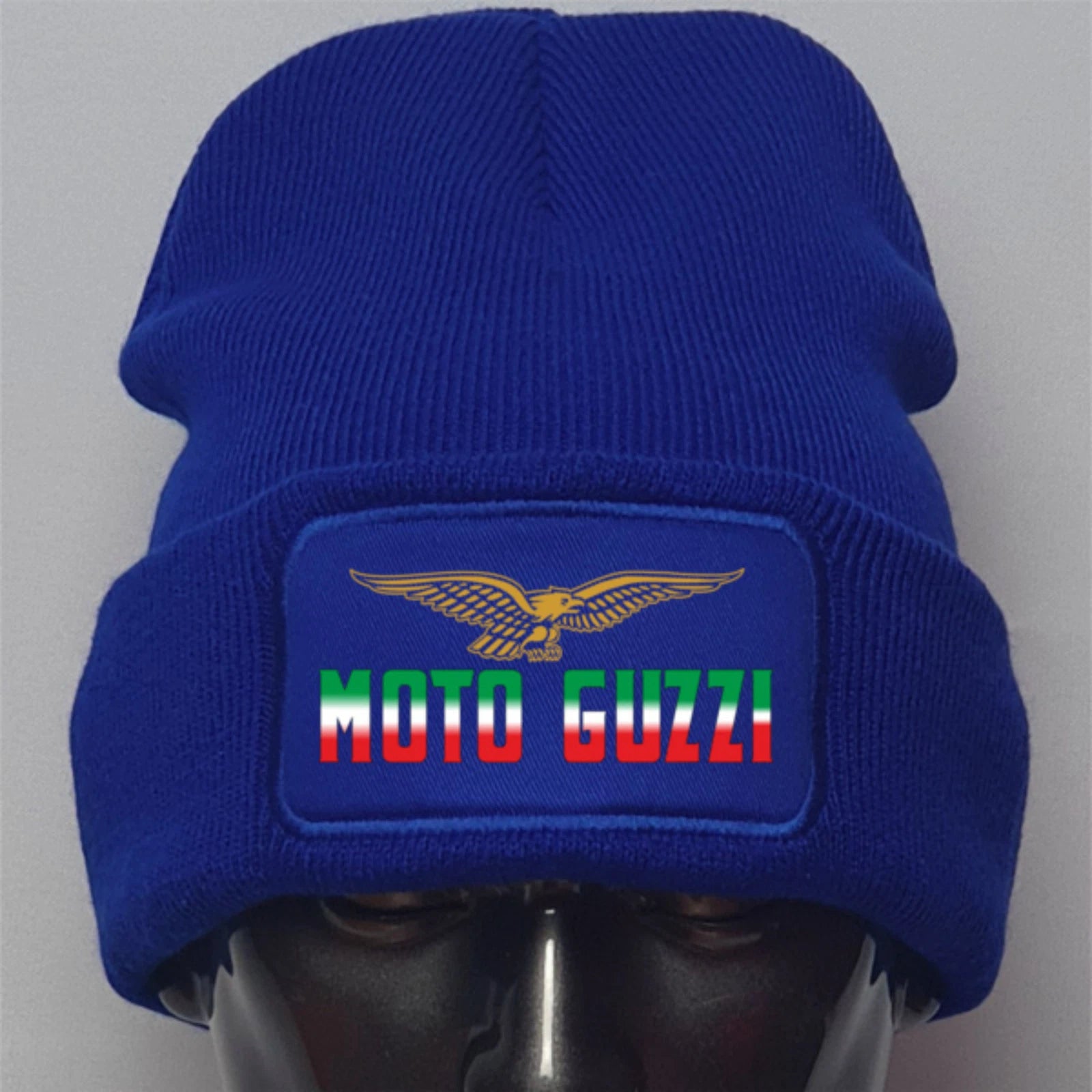 Blue beanie with Moto Guzzi logo on a gray background