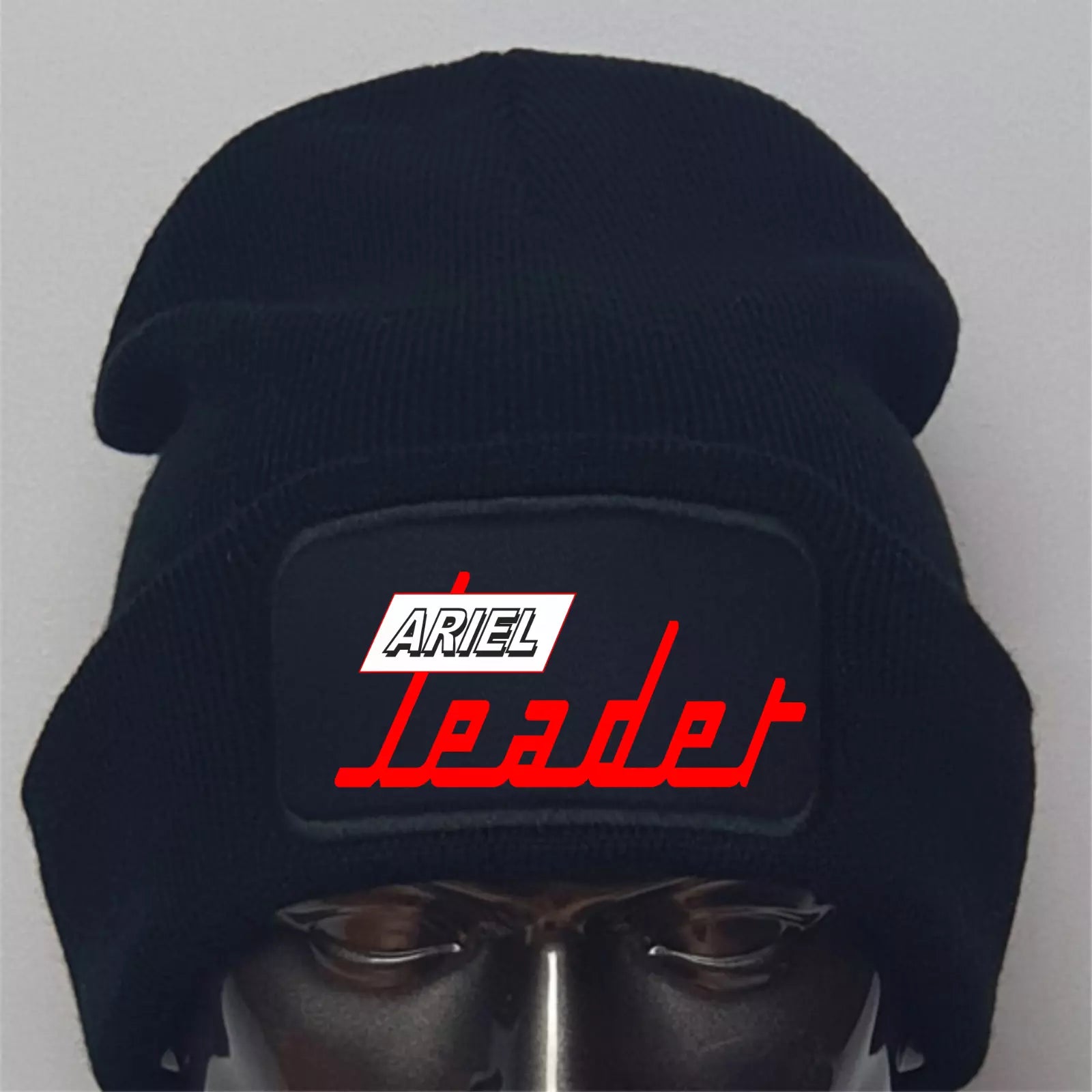 Black beanie with 'Ariel Leader' logo on a gray background