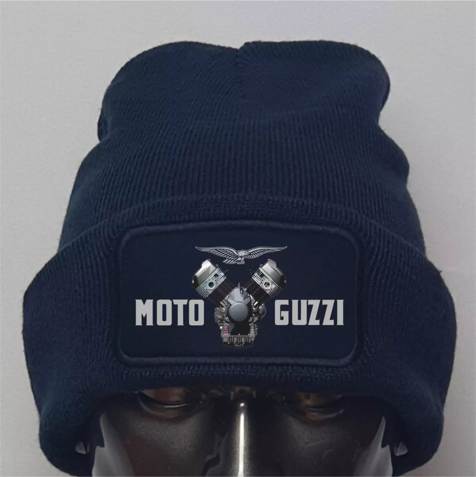 Navy blue beanie with Moto Guzzi logo on a gray background
