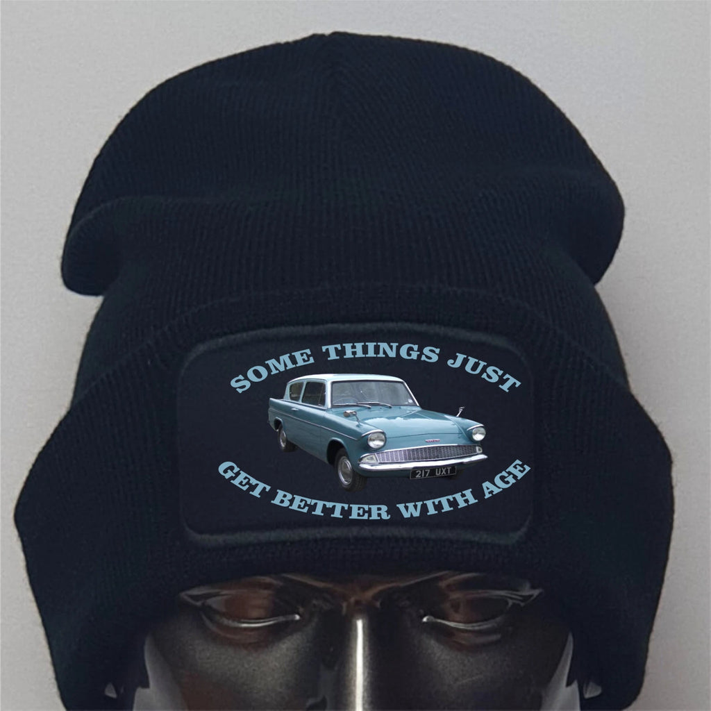 Black beanie with vintage car graphic and text on a mannequin head against a gray background