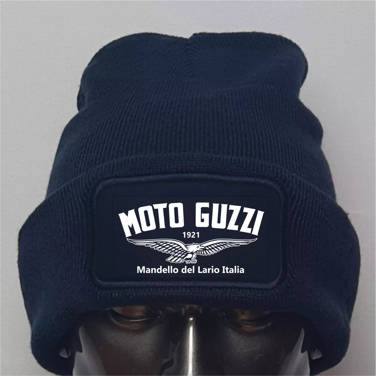 Navy blue beanie with Moto Guzzi logo on a gray background